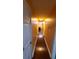 A long hallway with wood floors and painted walls leads to other rooms in the house at 3129 Rock Pine Way, Snellville, GA 30078