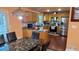 Well-lit kitchen features stainless steel appliances, light wood cabinets, and a cozy dining area at 3129 Rock Pine Way, Snellville, GA 30078