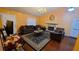 Comfortable living room with hardwood floors, a fireplace, and ample seating, perfect for relaxation at 3129 Rock Pine Way, Snellville, GA 30078
