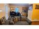Cozy living room flowing into a dining area, featuring a plush sofa and neutral wall colors at 3129 Rock Pine Way, Snellville, GA 30078