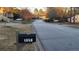 A street view of the neighborhood, featuring the house's mailbox with the address clearly displayed at 3129 Rock Pine Way, Snellville, GA 30078