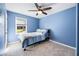 Blue bedroom with natural light, a ceiling fan, and plush carpeting at 735 Princeton Mill Run, Marietta, GA 30068