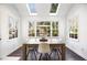 Bright dining room with a rustic wooden table and natural lighting at 735 Princeton Mill Run, Marietta, GA 30068