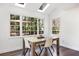 Bright dining room with a rustic wooden table and natural lighting at 735 Princeton Mill Run, Marietta, GA 30068