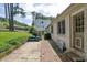 A cozy backyard patio with brick accents and room for outdoor seating at 2107 Old Dallas Sw Rd, Marietta, GA 30064