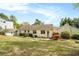 Expansive backyard with lush grass, mature trees, and a charming brick home exterior at 2107 Old Dallas Sw Rd, Marietta, GA 30064