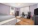 Bedroom featuring hardwood floors, a bed, and a desk setup at 2107 Old Dallas Sw Rd, Marietta, GA 30064