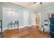 Bedroom featuring hardwood floors, a ceiling fan, and light blue walls at 2107 Old Dallas Sw Rd, Marietta, GA 30064