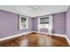 Bright bedroom featuring hardwood floors, natural light, and crown molding at 2107 Old Dallas Sw Rd, Marietta, GA 30064
