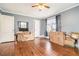 Bedroom with hardwood floors, a ceiling fan, and boxes ready for moving at 2107 Old Dallas Sw Rd, Marietta, GA 30064