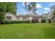 Charming single-story home with a lush green lawn, trimmed hedges, and a welcoming facade at 2107 Old Dallas Sw Rd, Marietta, GA 30064