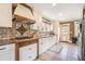 Well-appointed kitchen with tile backsplash, modern appliances, and ample counter space at 2107 Old Dallas Sw Rd, Marietta, GA 30064