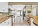 Bright kitchen with white cabinets, tiled backsplash, stainless steel appliances, and tile floors at 2107 Old Dallas Sw Rd, Marietta, GA 30064