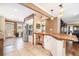 Open kitchen with a butcher block island, stainless steel appliances, and adjacent seating area at 2107 Old Dallas Sw Rd, Marietta, GA 30064