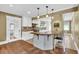 Well-lit kitchen featuring white cabinets, granite countertops, and a center island with breakfast bar at 2107 Old Dallas Sw Rd, Marietta, GA 30064