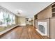 Bright living room features hardwood floors, large windows, and a fireplace with built-in cabinets at 2107 Old Dallas Sw Rd, Marietta, GA 30064
