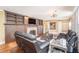 Cozy living room with built-in shelving, a brick fireplace, and comfortable leather seating at 2107 Old Dallas Sw Rd, Marietta, GA 30064