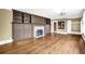 Living room with hardwood floors, built-in shelves, cabinets, and a view into another living space at 2107 Old Dallas Sw Rd, Marietta, GA 30064