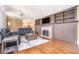 Cozy living room featuring a fireplace, hardwood floors, and built-in bookshelves at 2107 Old Dallas Sw Rd, Marietta, GA 30064