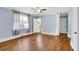 Comfortable main bedroom with hardwood floors, blue walls, natural light, and a bathroom entrance at 2107 Old Dallas Sw Rd, Marietta, GA 30064