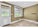 Cozy mud room with a door to the outside, natural light, neutral paint, and tiled floors at 2107 Old Dallas Sw Rd, Marietta, GA 30064