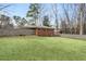 Wide shot of a large backyard enclosed by a wooden fence, great for privacy and recreation at 3245 Westmart Ln, Atlanta, GA 30340