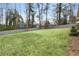 Spacious, level backyard enclosed by a gray wooden fence, perfect for outdoor activities at 3245 Westmart Ln, Atlanta, GA 30340