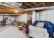 Open unfinished basement offers flexible space with exposed ductwork and painted concrete flooring at 3245 Westmart Ln, Atlanta, GA 30340