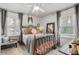 Cozy bedroom with a wrought iron bed, soft textures, and natural light at 3245 Westmart Ln, Atlanta, GA 30340
