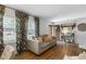 Inviting living room with sofa, windows, and hardwood floors at 3245 Westmart Ln, Atlanta, GA 30340