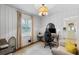 Bright office space with paneled walls, a patterned rug, and a comfortable seating area at 3245 Westmart Ln, Atlanta, GA 30340