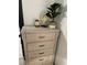 Bedroom cabinet with decorative elements and a plant for decoration at 1074 Hobson Sw St, Atlanta, GA 30310