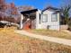 Beautiful home featuring orange steps, modern railings, brick accents, and a sidewalk at 1074 Hobson Sw St, Atlanta, GA 30310