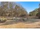 Large backyard with a fire pit and wooden fencing at 238 Chappell Rd, Fayetteville, GA 30215