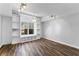 Bright bedroom with built-in shelving, a window seat, wood floors and a ceiling fan at 238 Chappell Rd, Fayetteville, GA 30215