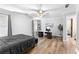 Bright bedroom with a ceiling fan, desk, and plenty of natural light from the window at 238 Chappell Rd, Fayetteville, GA 30215