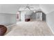 Spacious bonus room featuring neutral walls, carpet, a window and unique architecture at 238 Chappell Rd, Fayetteville, GA 30215