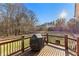 Covered porch with wooden deck, railings, and a beautiful backyard at 238 Chappell Rd, Fayetteville, GA 30215