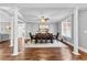 Formal dining room featuring hardwood floors, decorative columns, and a modern ceiling fan at 238 Chappell Rd, Fayetteville, GA 30215