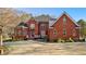 Stately two-story brick home with a manicured lawn and mature landscaping at 238 Chappell Rd, Fayetteville, GA 30215