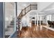 Welcoming foyer with hardwood floors, staircase, and views of the open-concept living spaces at 238 Chappell Rd, Fayetteville, GA 30215