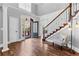 Elegant foyer with hardwood floors, a staircase, and an abundance of natural light at 238 Chappell Rd, Fayetteville, GA 30215