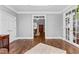 Bright living room featuring hardwood floors, white trim, and french doors to the exterior at 238 Chappell Rd, Fayetteville, GA 30215