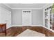 Bright living room featuring hardwood floors, white trim, and french doors to the exterior at 238 Chappell Rd, Fayetteville, GA 30215