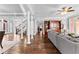 Open concept living room featuring hardwood floors, columns, and a large grey sofa at 238 Chappell Rd, Fayetteville, GA 30215