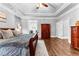 Large main bedroom featuring a tray ceiling, and hardwood floors with a doorway to a dressing area at 238 Chappell Rd, Fayetteville, GA 30215