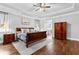 Spacious main bedroom with tray ceiling, hardwood floors, and access to the ensuite bathroom at 238 Chappell Rd, Fayetteville, GA 30215