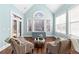 Bright sun room featuring a vaulted ceiling, hardwood floors, and oversized windows at 238 Chappell Rd, Fayetteville, GA 30215