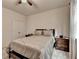 Neutral bedroom features a queen bed, side tables, and natural light from the window at 3030 Appling Hills Dr, Dacula, GA 30019