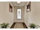 Bright foyer with hardwood floors and elegant decor, leading to the main living area at 3030 Appling Hills Dr, Dacula, GA 30019